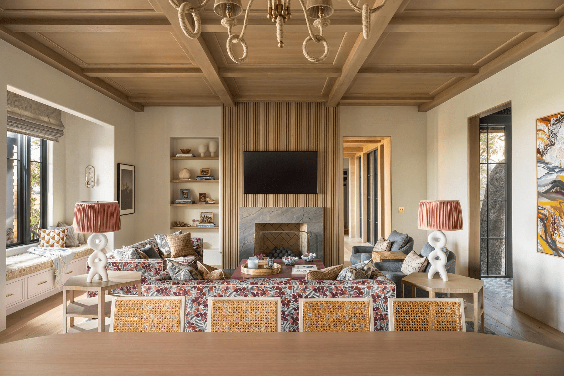 Luxury custom living room with wood coffered ceiling and stone fireplace